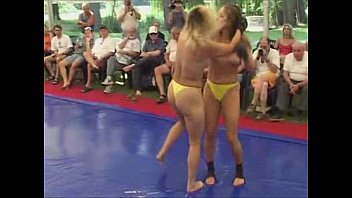 Two hot women wrestling topless in a ring - PornZog Free Porn Clips